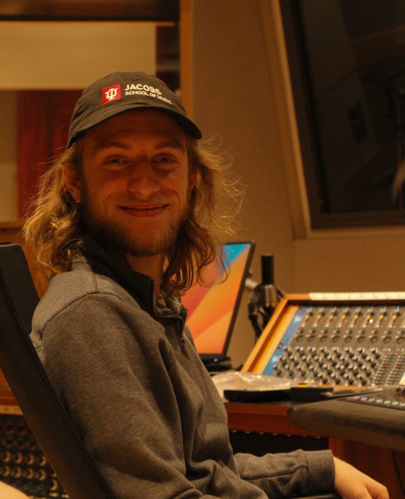 Benjamin Stephens siting in front of audio equipment